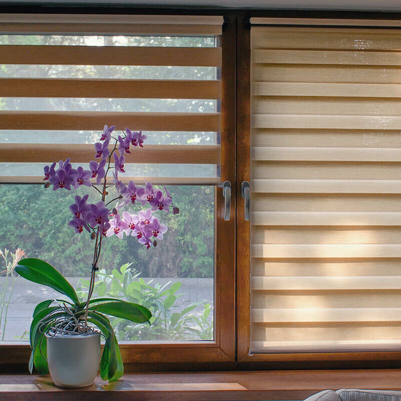 Custom window treatment with flower on window sill