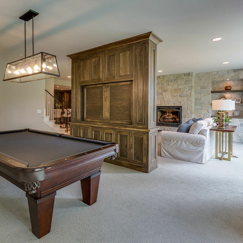 Family room with pool table and plush gray carpet