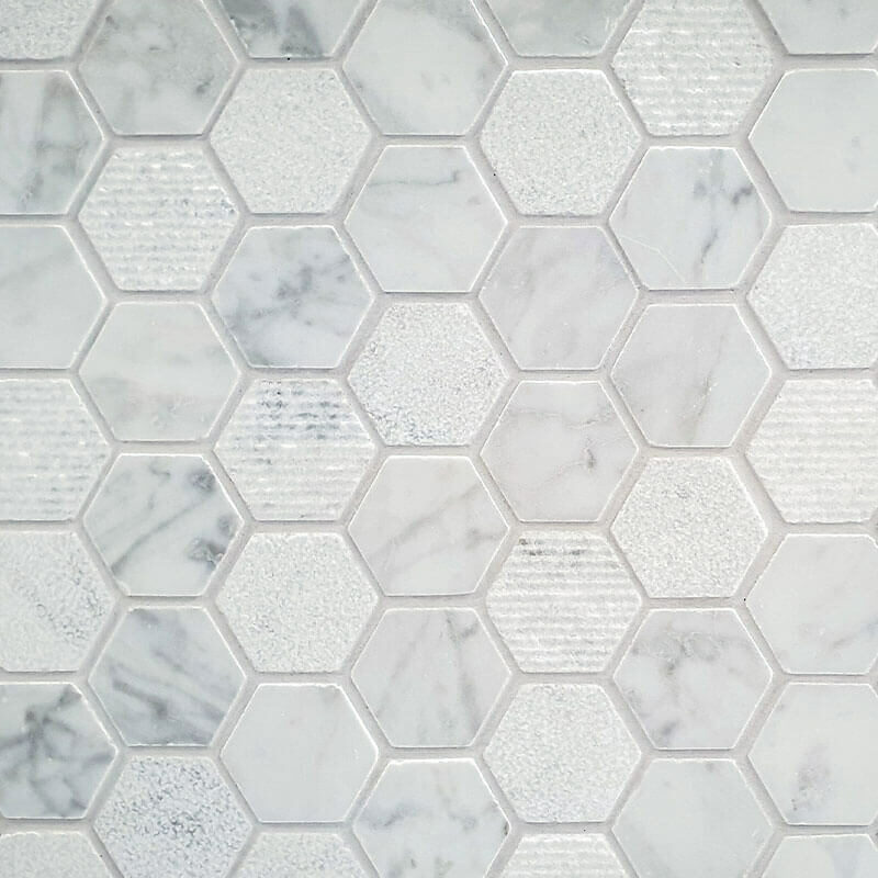 Closeup detail image of small white hexagon tile with gray veining